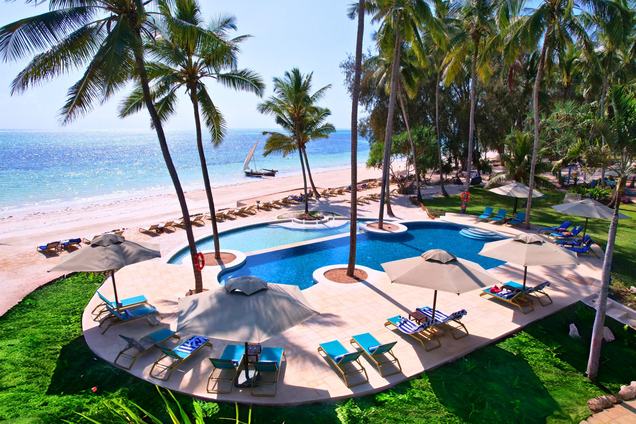 Aerial view of Bluebay Beach Resort's pool, beach and palm gardens on the Kiwengwa coast