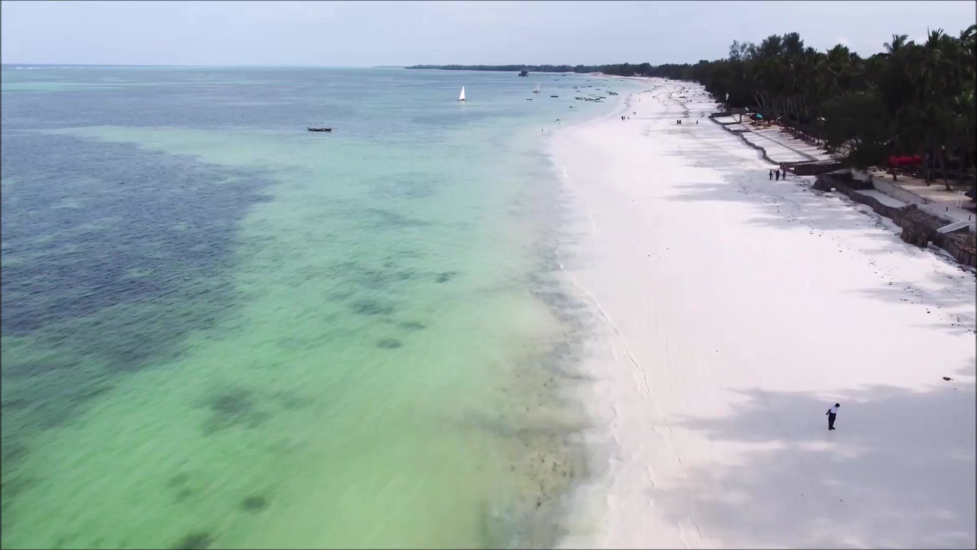 Aerial of the 582 m white-sand beach and turquoise reef