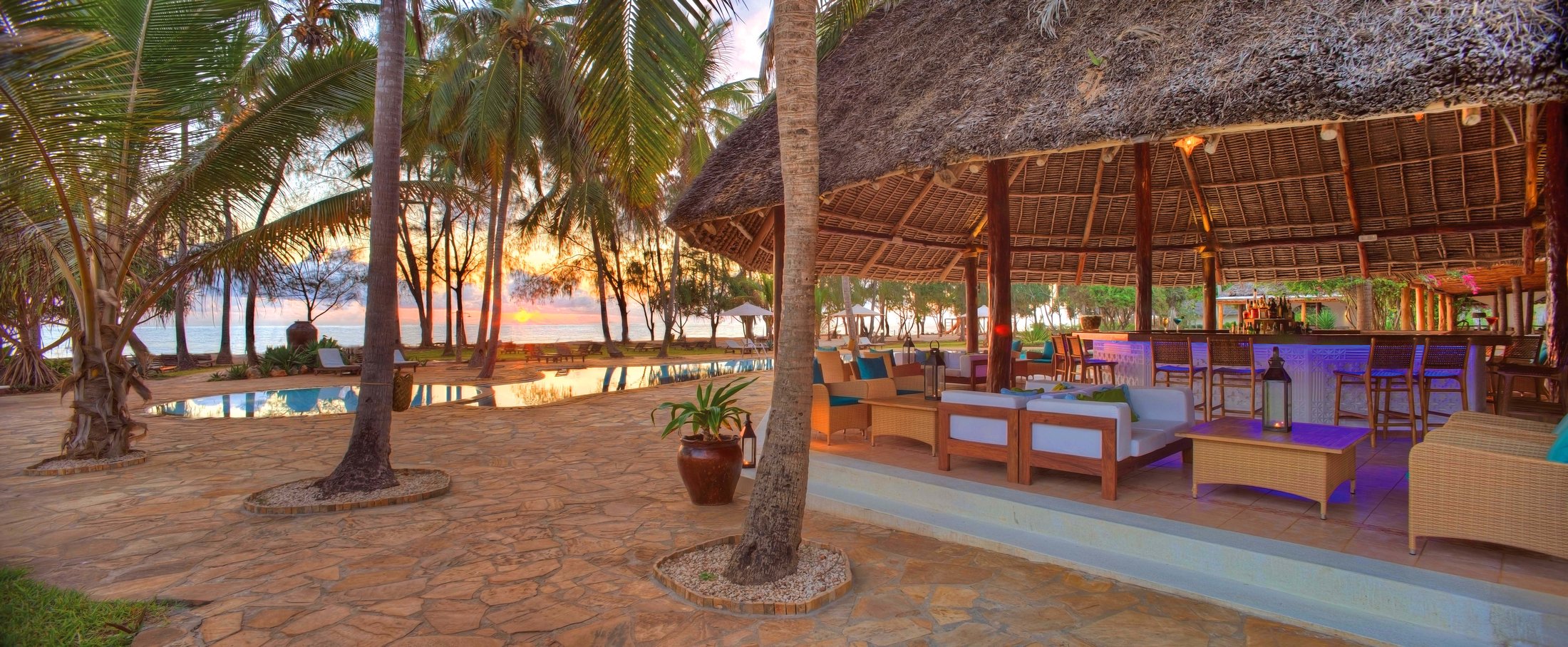 Beachfront bar and lounge under a makuti roof